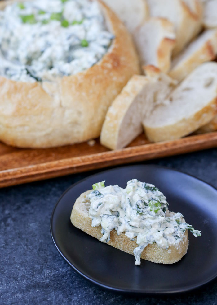 Creamy Spinach Dip with Water Chestnuts - The classic cold spinach dip, minus the veggie soup mix, served up in a sourdough bowl. Easy, addicting, with dairy-free and vegan options!