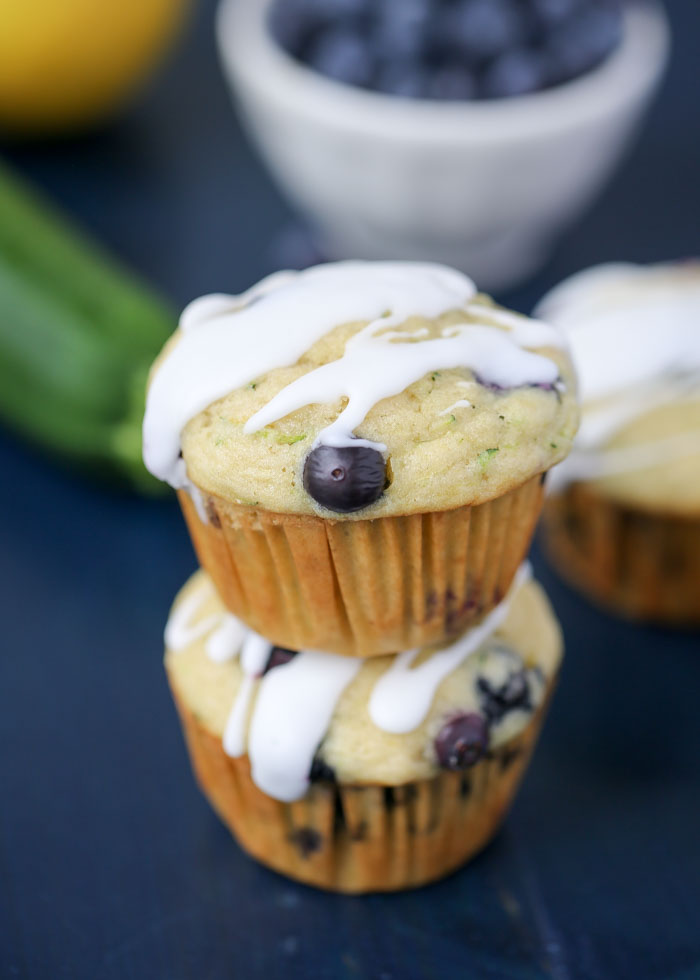 Zucchini Lemon Blueberry Muffins - Moist and lemony with flecks of zucchini and bursts of blueberry. These summery muffins are a new seasonal favorite around here!