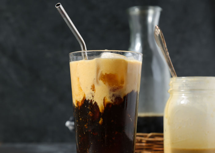 Vegan Pumpkin Cream Cold Brew recipe - A chilled coconut-milk-based pumpkin cream tops icy cold brew for the perfect bridge between summer and fall. #pumpkincreamcoldbrew