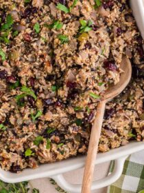 top view of Herbed Quinoa & Wild Rice Stuffing with a wooden spoon