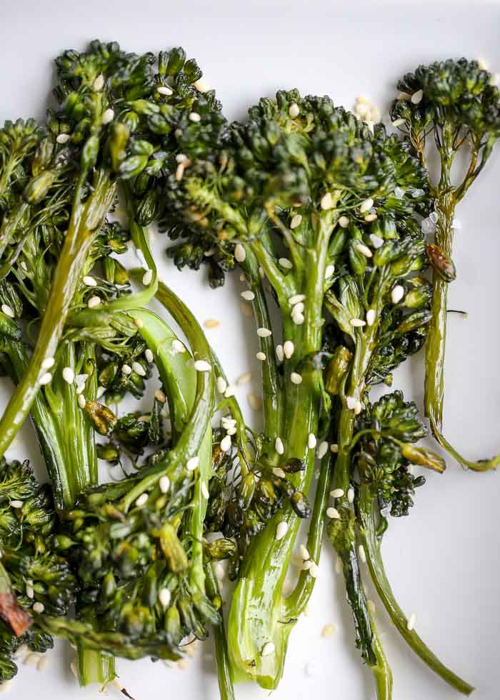 Super Simple Sesame Roasted Broccolini recipe - This super simple side whips up quickly and is super tasty. I'm marketing it as a side, but I've also been known to just eat it as a snack, like fries!