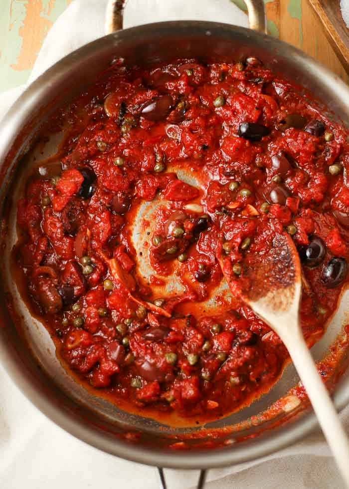 Vegan Puttanesca Sauce - Rich with with garlic, kalamata olives, and capers, this piquant, concentrated sauce is a serious fave around here. Serve with whatever pasta you happen to have on hand!