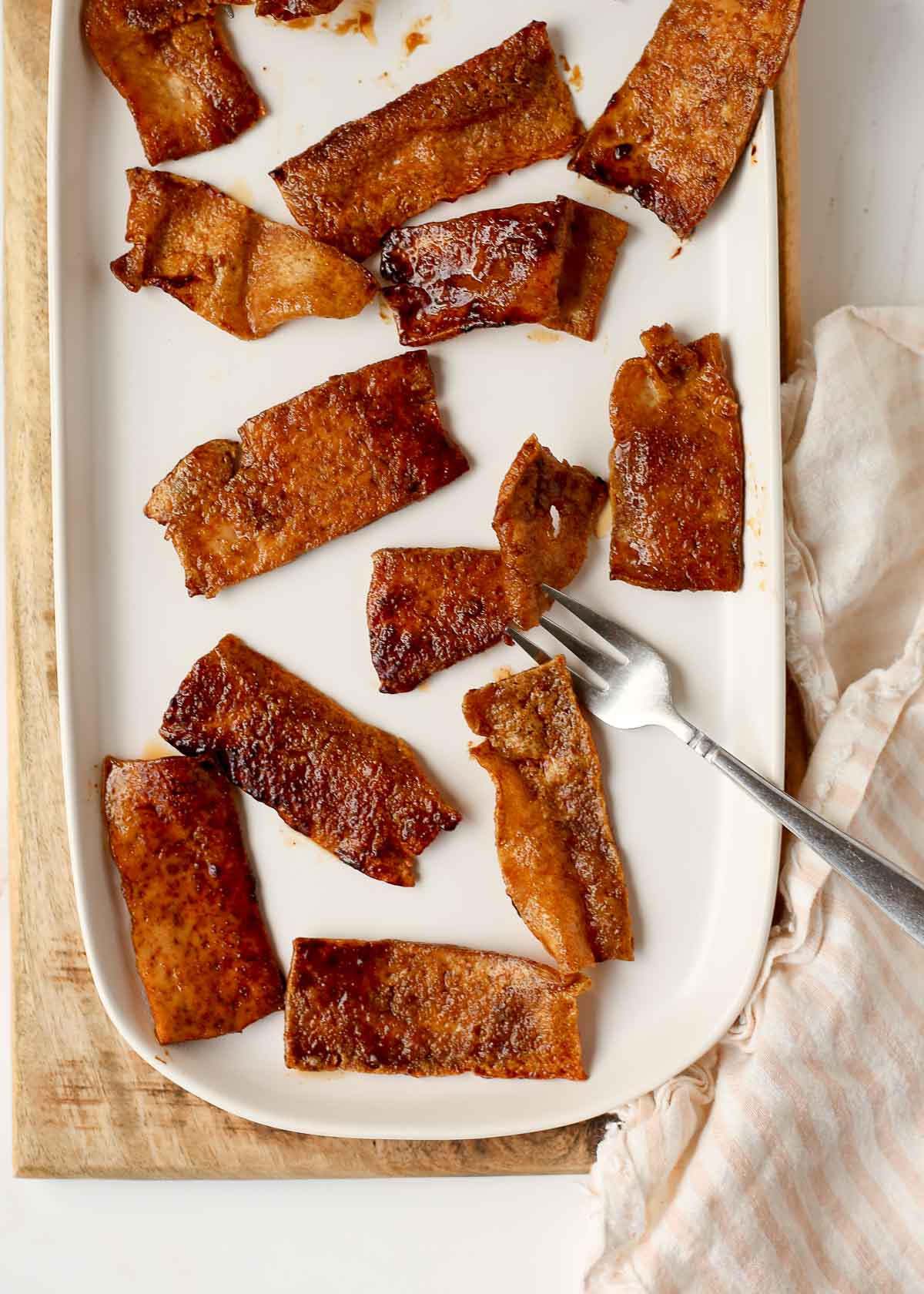 Tofu bacon on a platter ready to eat