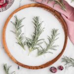 sugared rosemary in a bowl of sugar