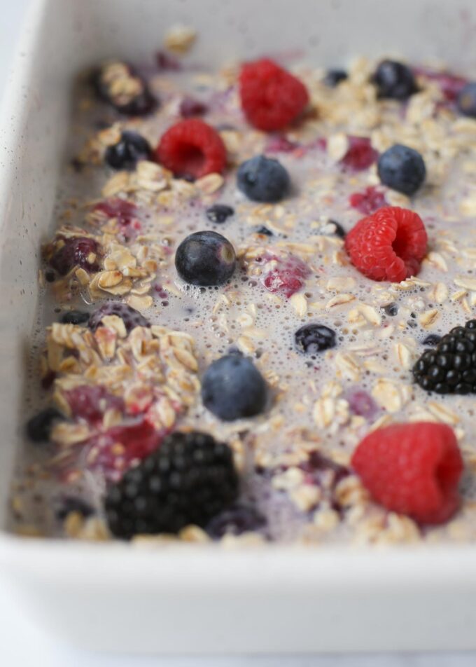 Overnight Berry Baked Oatmeal in a pan, ready to refrigerate overnight