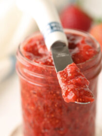 A glass jar full of strawberry chia seed jam
