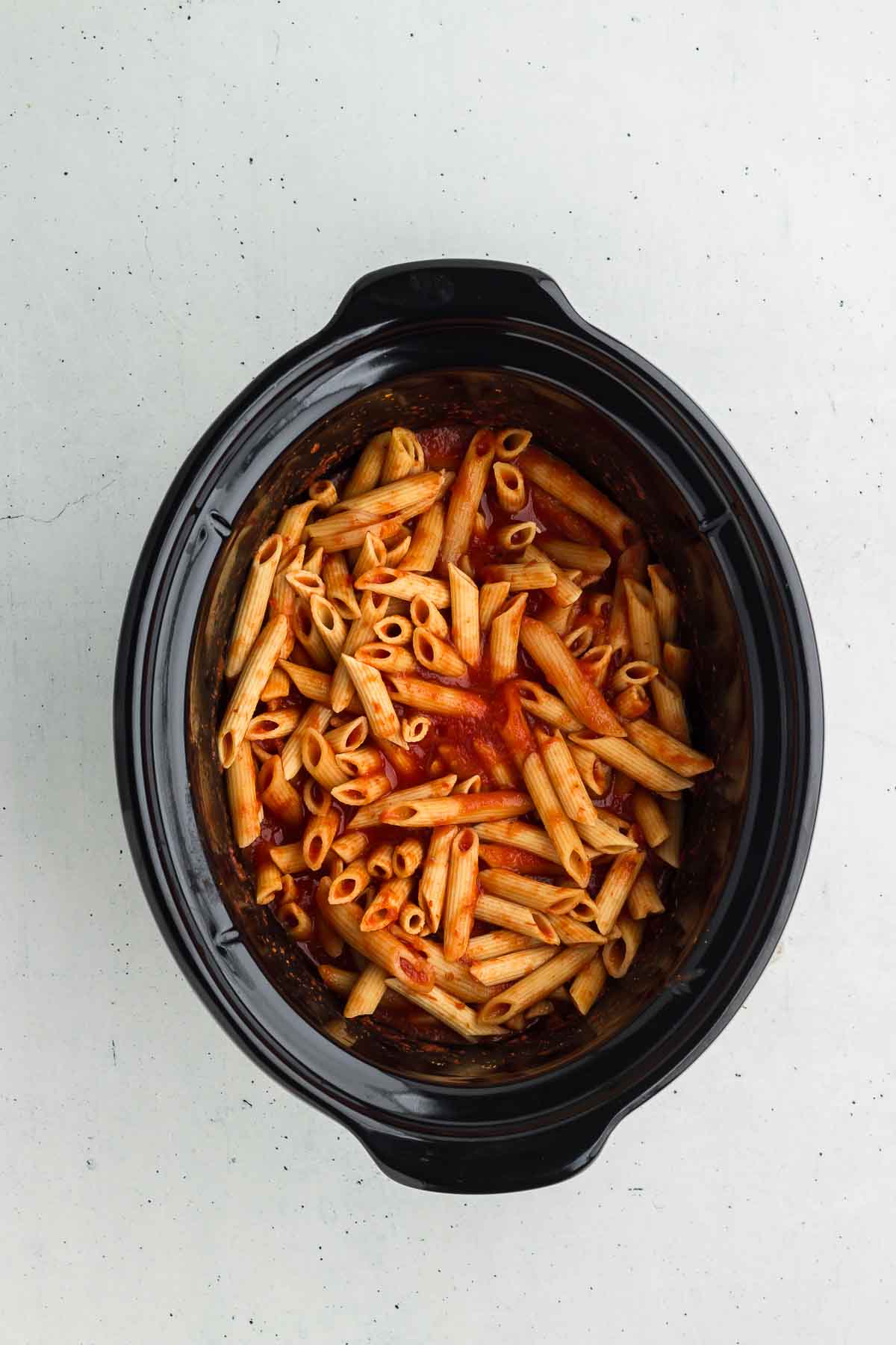 Ingredients for Crock Pot Baked Ziti in the slow cooker, ready to cook
