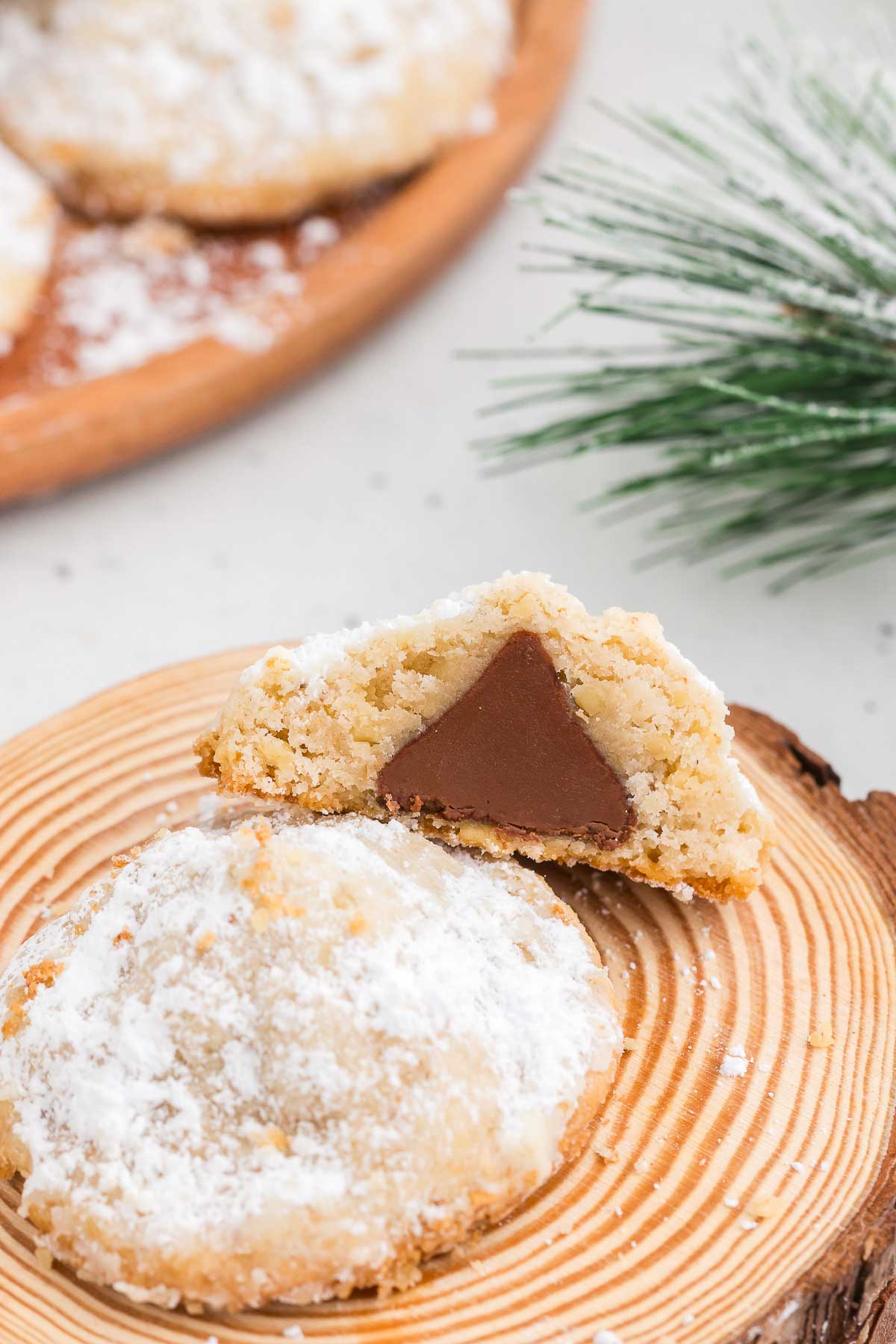 Hidden Kiss Cookies on a wood round