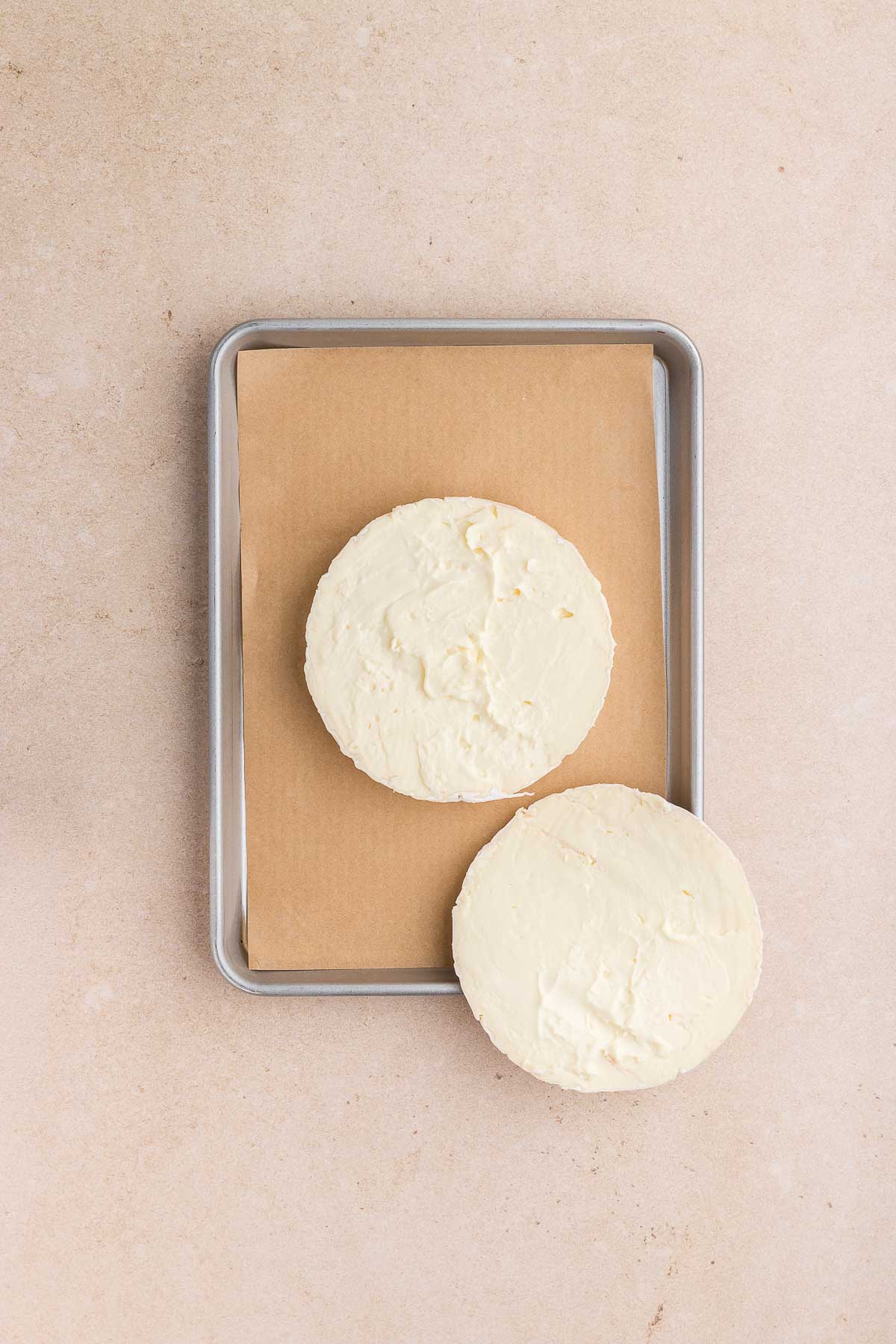 cutting the top rind off of the brie cheese