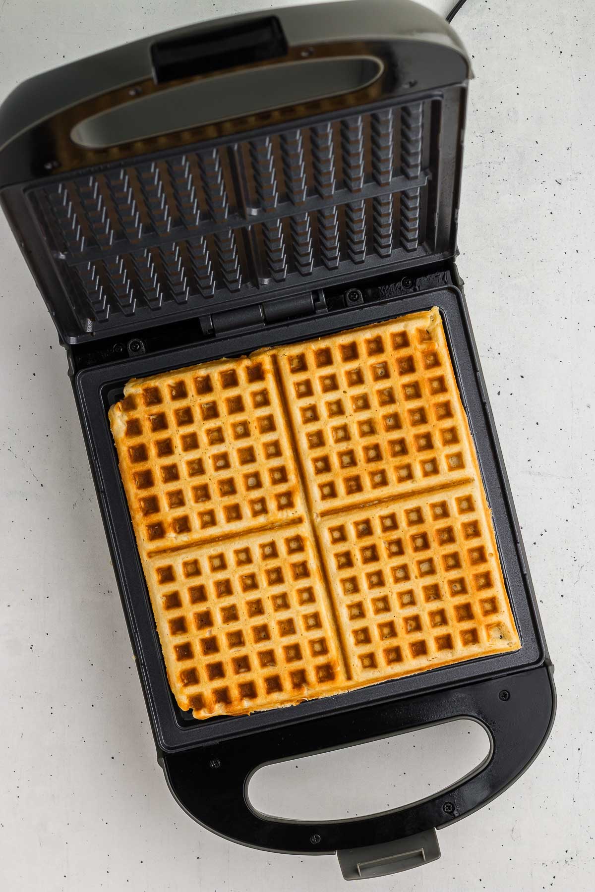 Golden waffles in a waffle maker