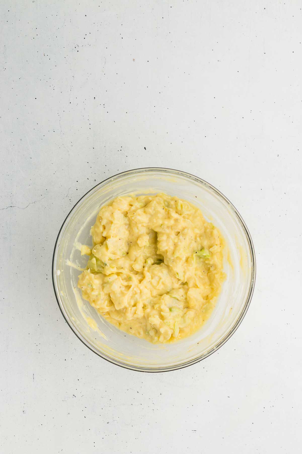 mixed batter for colcannon cakes in a glass bowl