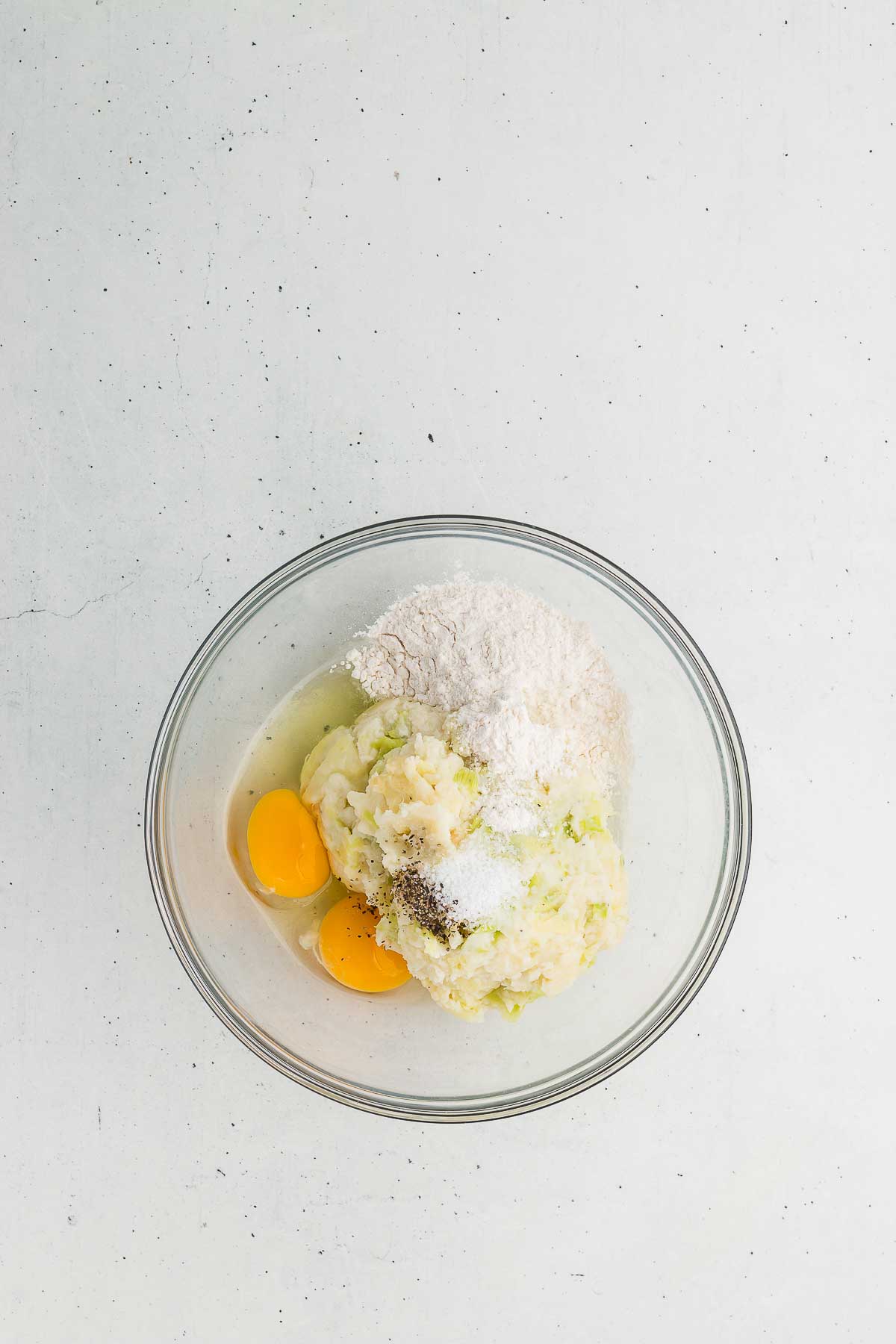 Ingredients for colcannon cakes in a bowl