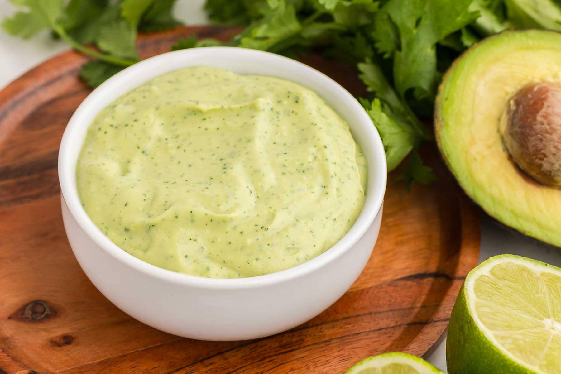 A white bowl full of Avocado Lime Crema