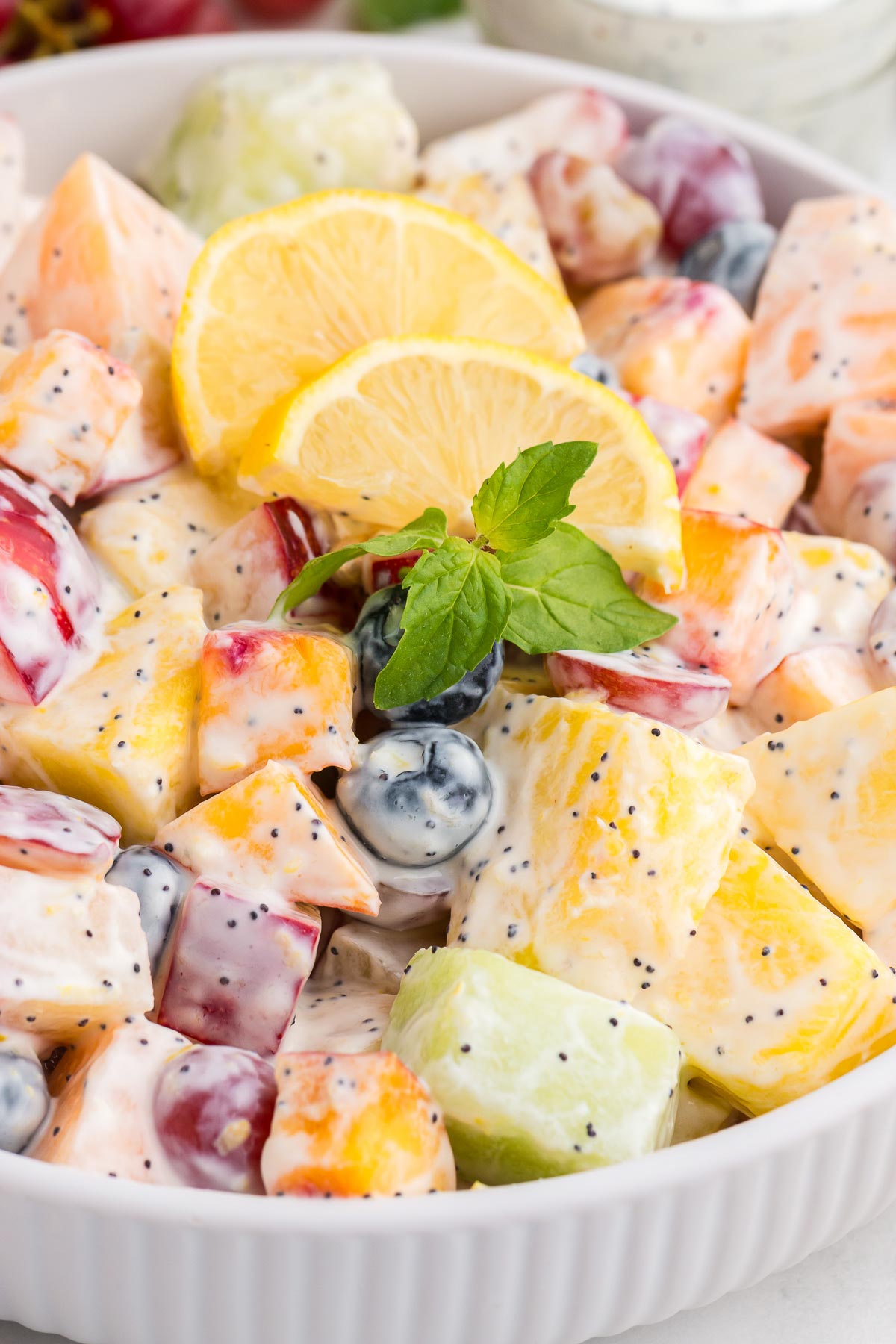 summer fruit salad covered with Lemon Poppyseed Fruit Salad Dressing