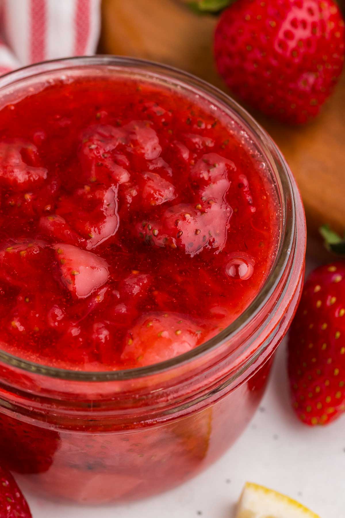 strawberry sauce close-up in a mason jar