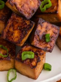 close-up of baked tofu with scallions