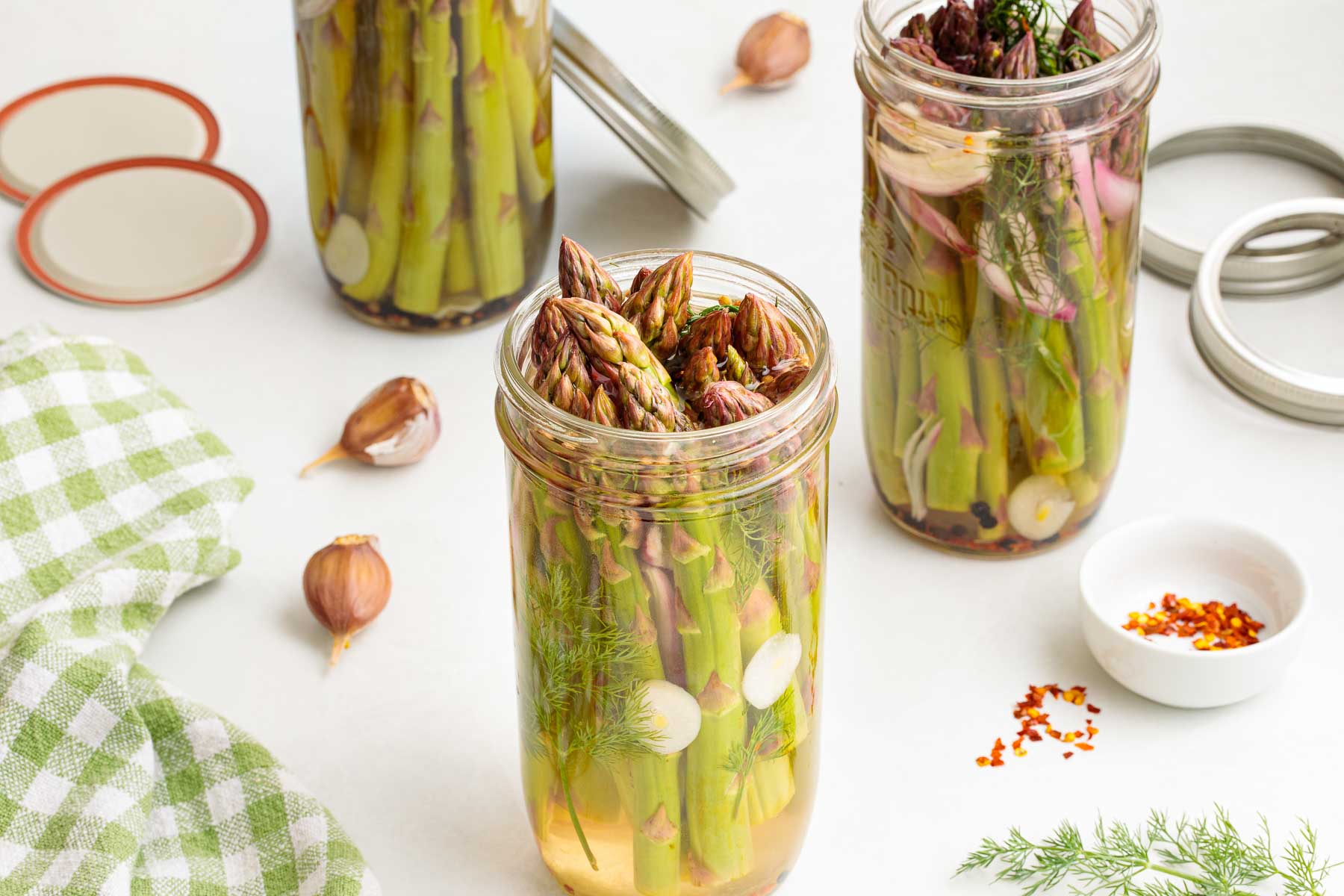 Three jars of quick pickled refrigerator pickled asparagus