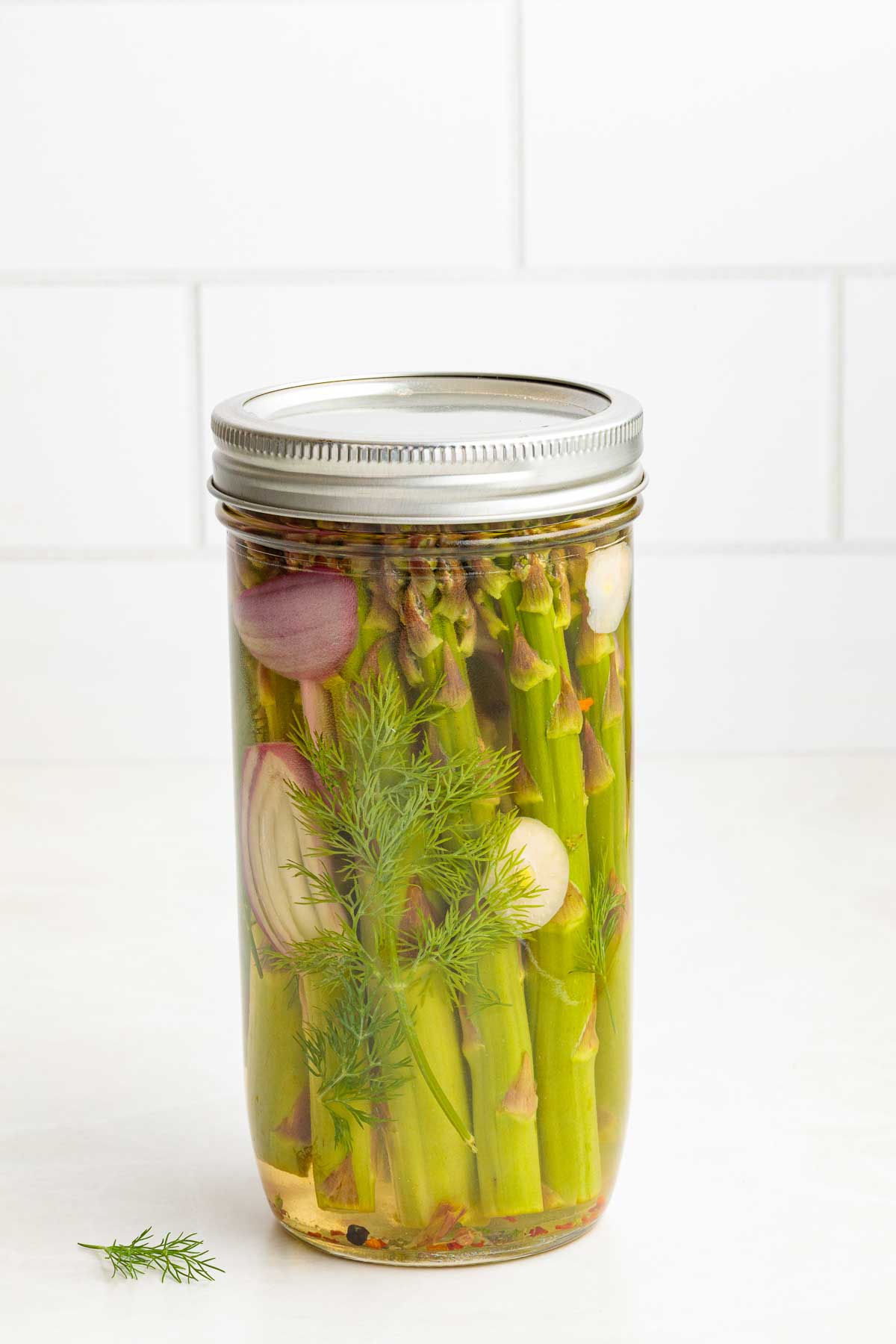 one jar of Quick Pickled Asparagus in a mason jar with lid