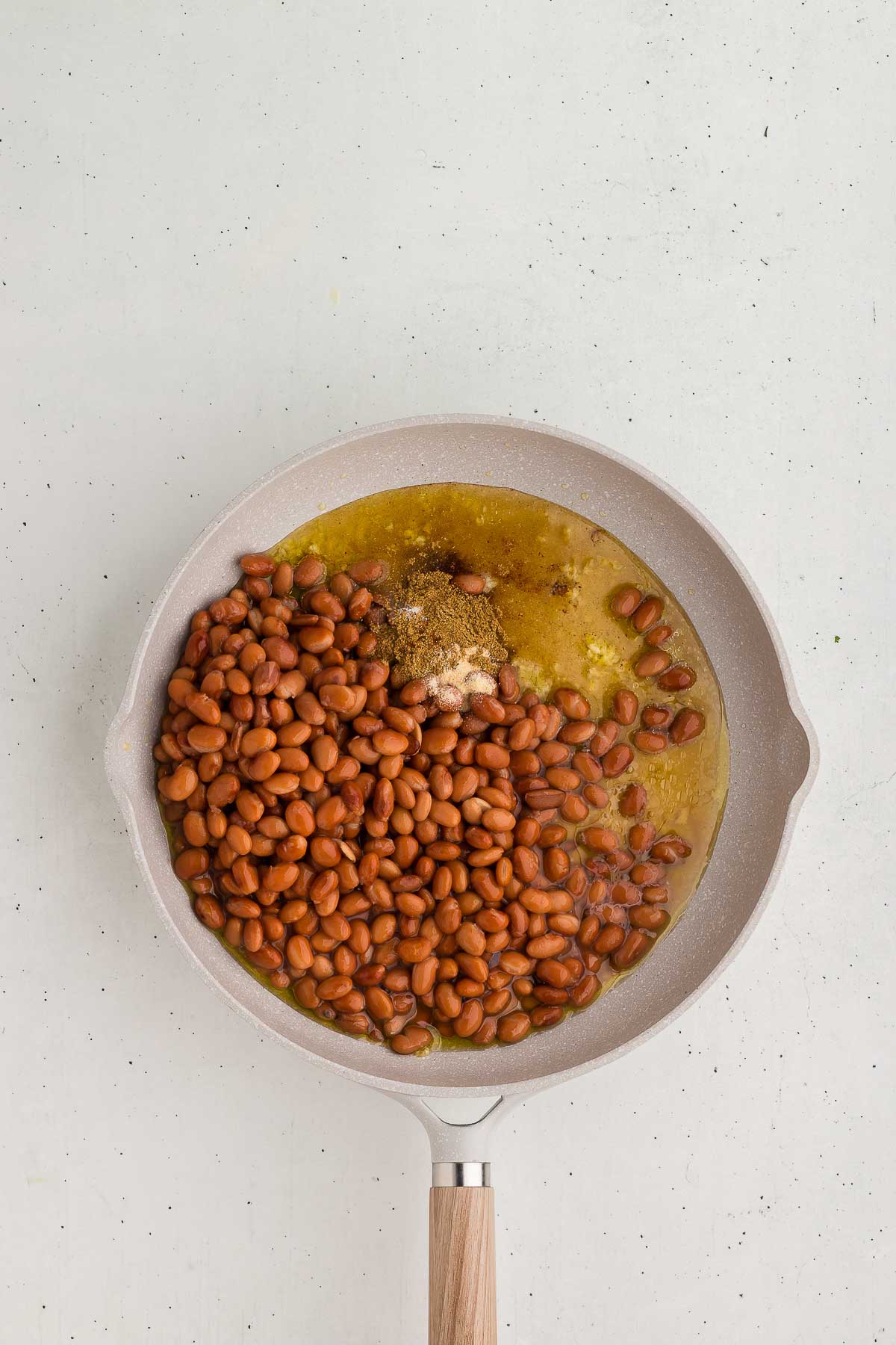 Ingredients for Homemade Refried Beans in a saute pan