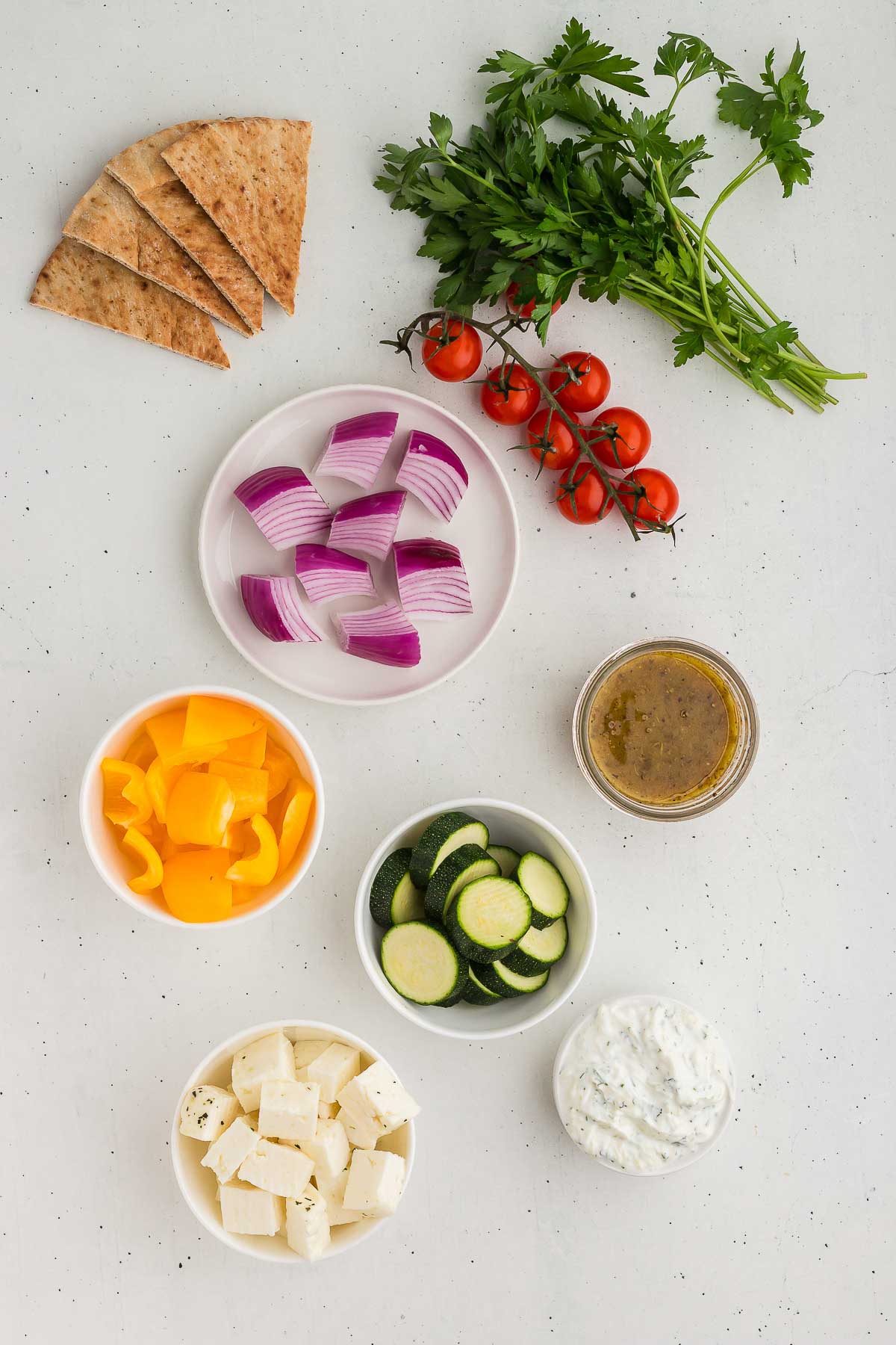 Ingredients for grilled halloumi and vegetable skewers