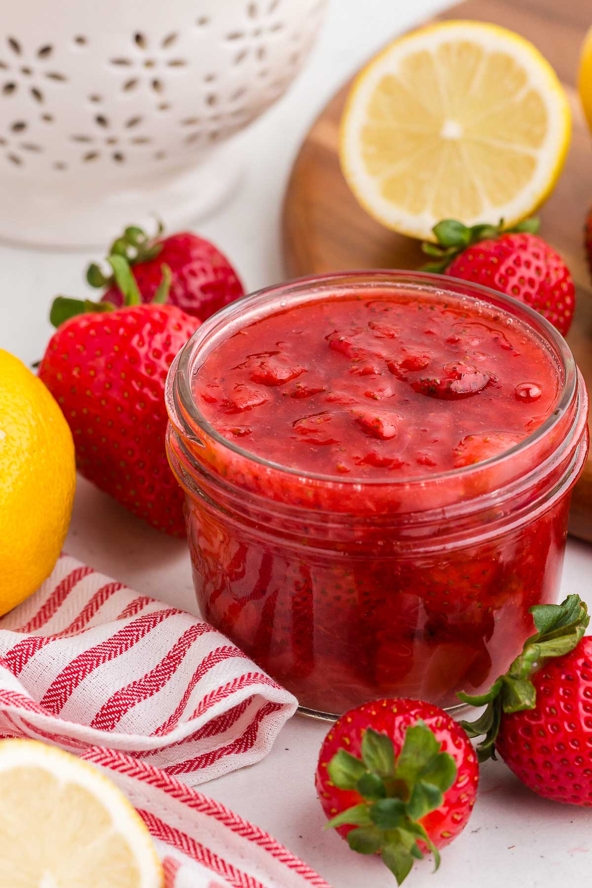 A mason jar full of strawberry sauce