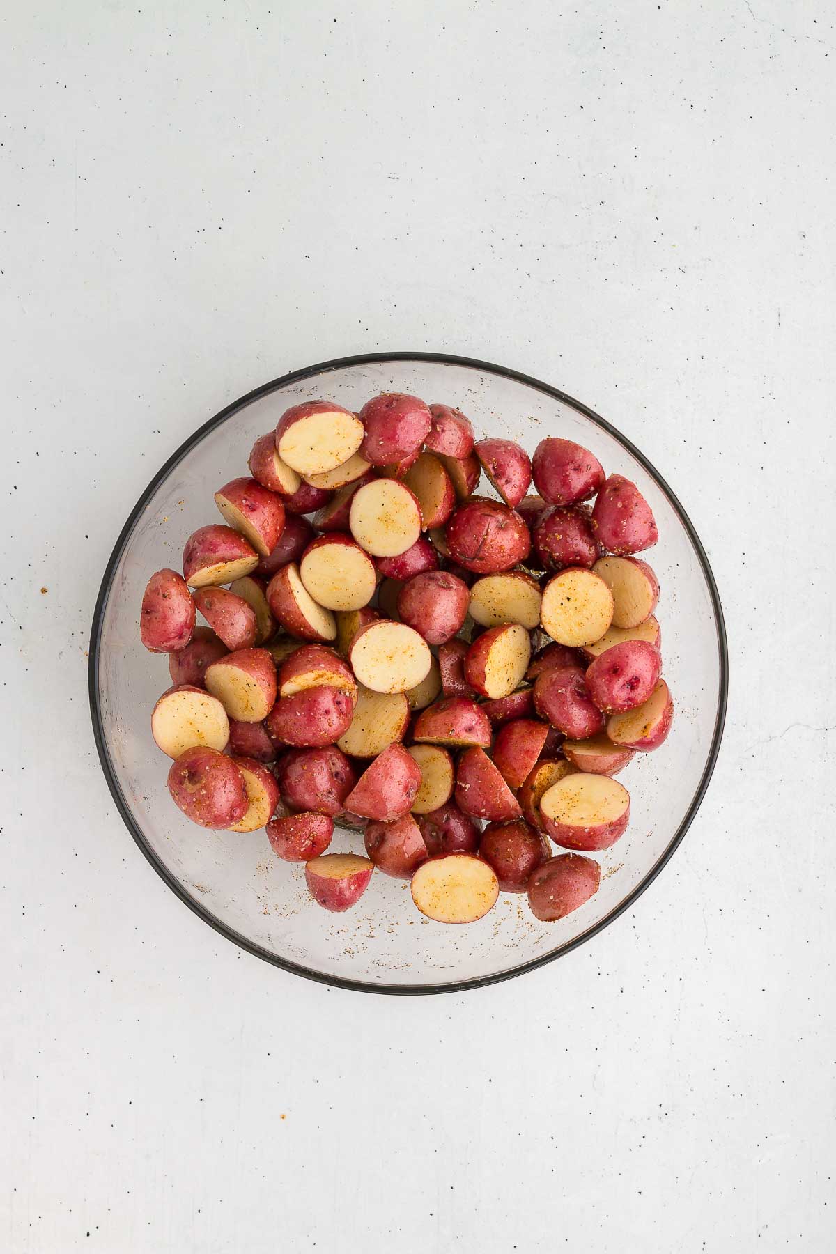 tossing potatoes in seasonings for Grilled Potatoes in Foil