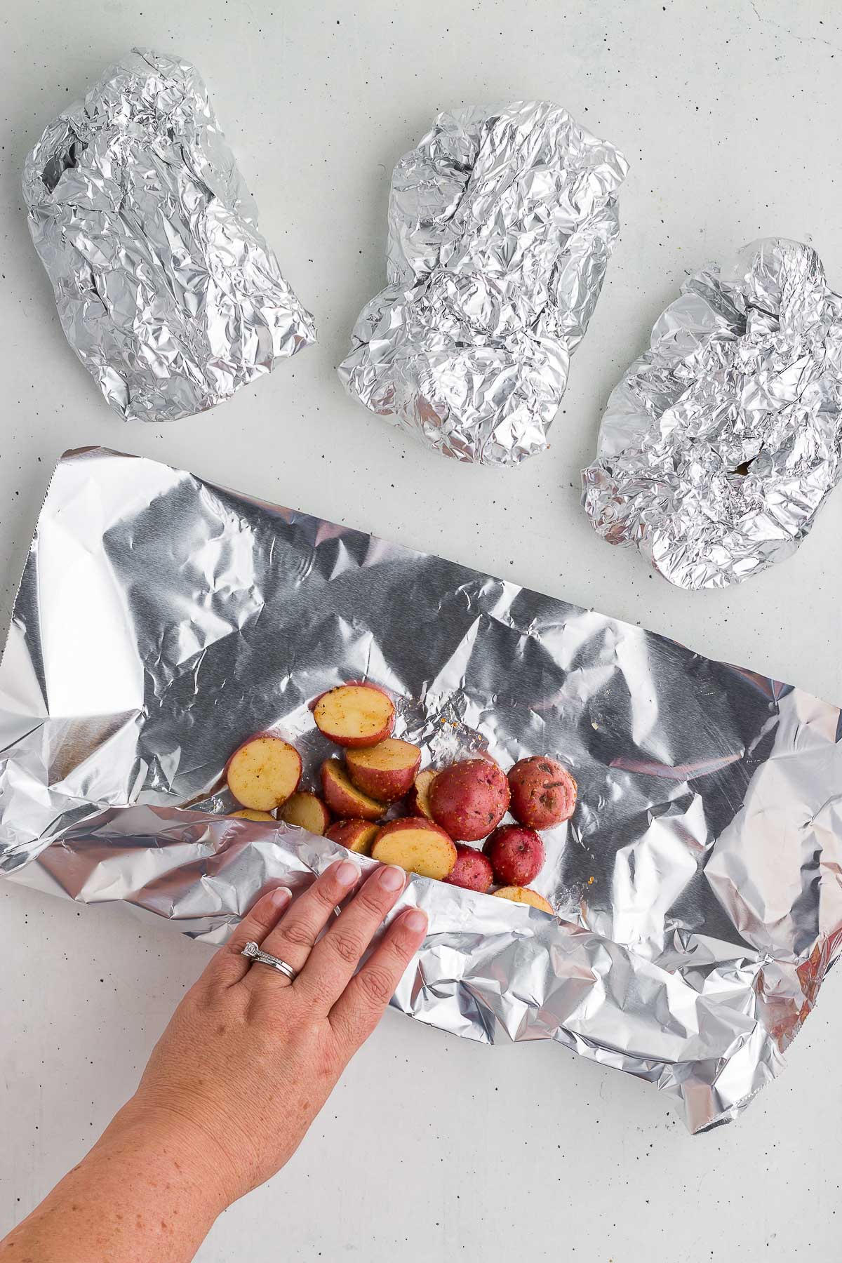 wrapping potatoes in foil for Grilled Potatoes in Foil