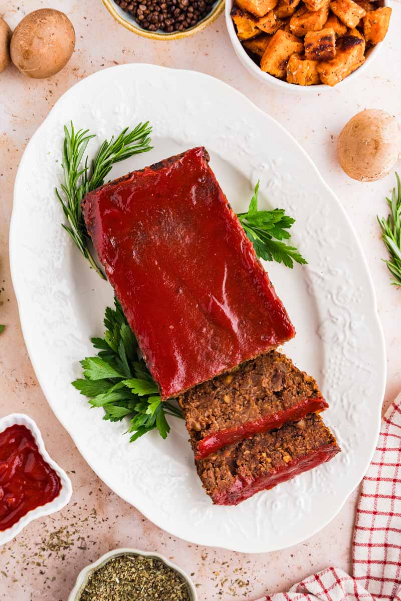 top view of Vegetarian Meatloaf on a white platter with garnishes
