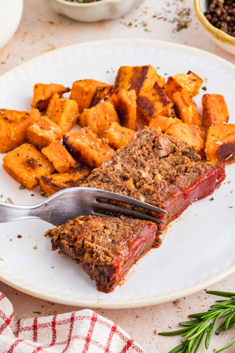 a fork cutting a bite of Vegetarian Meatloaf