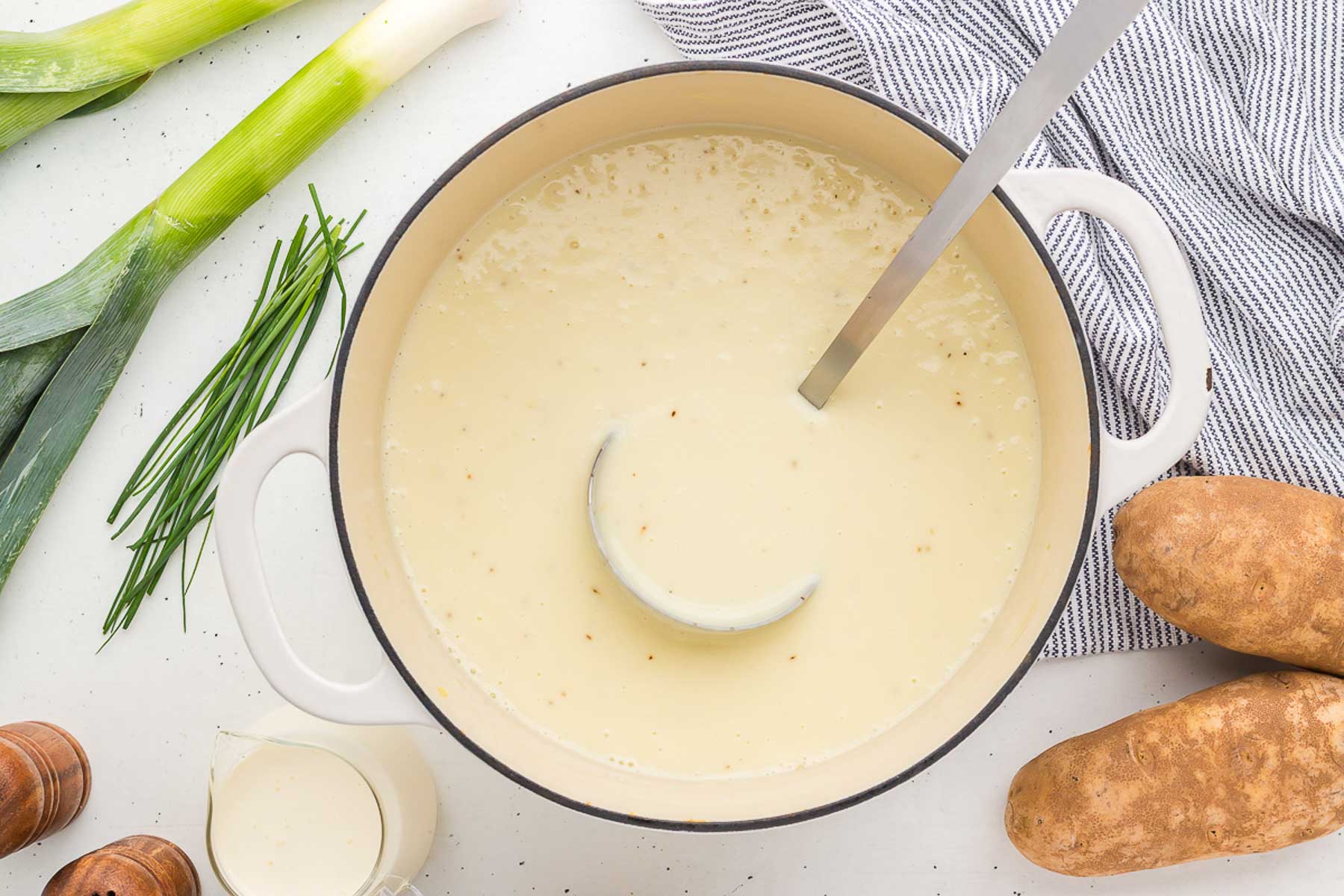 pot of potato leek soup with ladle