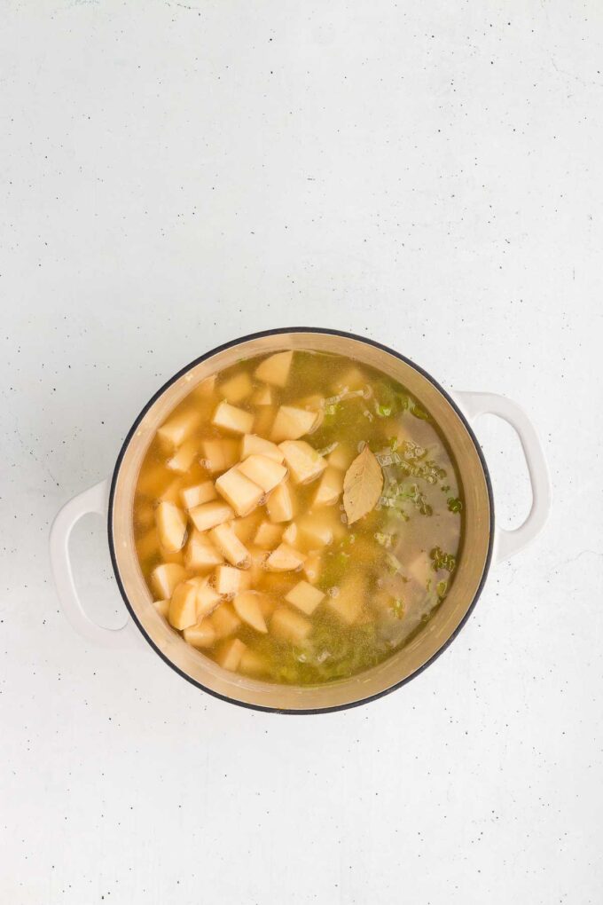 potatoes are added to the pot for potato leek soup