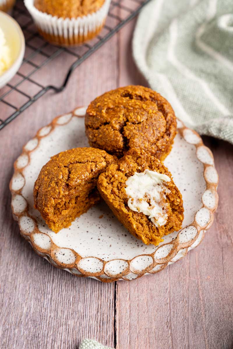 Blender Pumpkin Muffins on a plate with butter