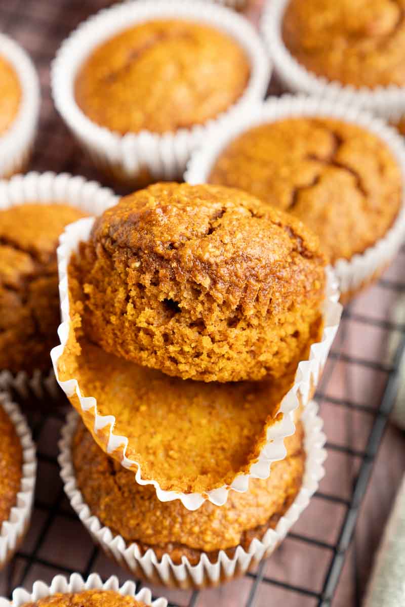 Blender Pumpkin Muffins with the wrapper being pulled off