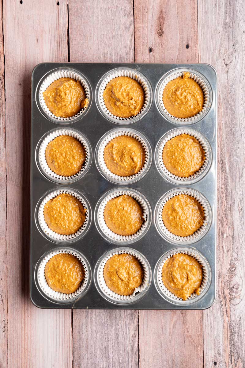 batter in cups for blender pumpkin muffins