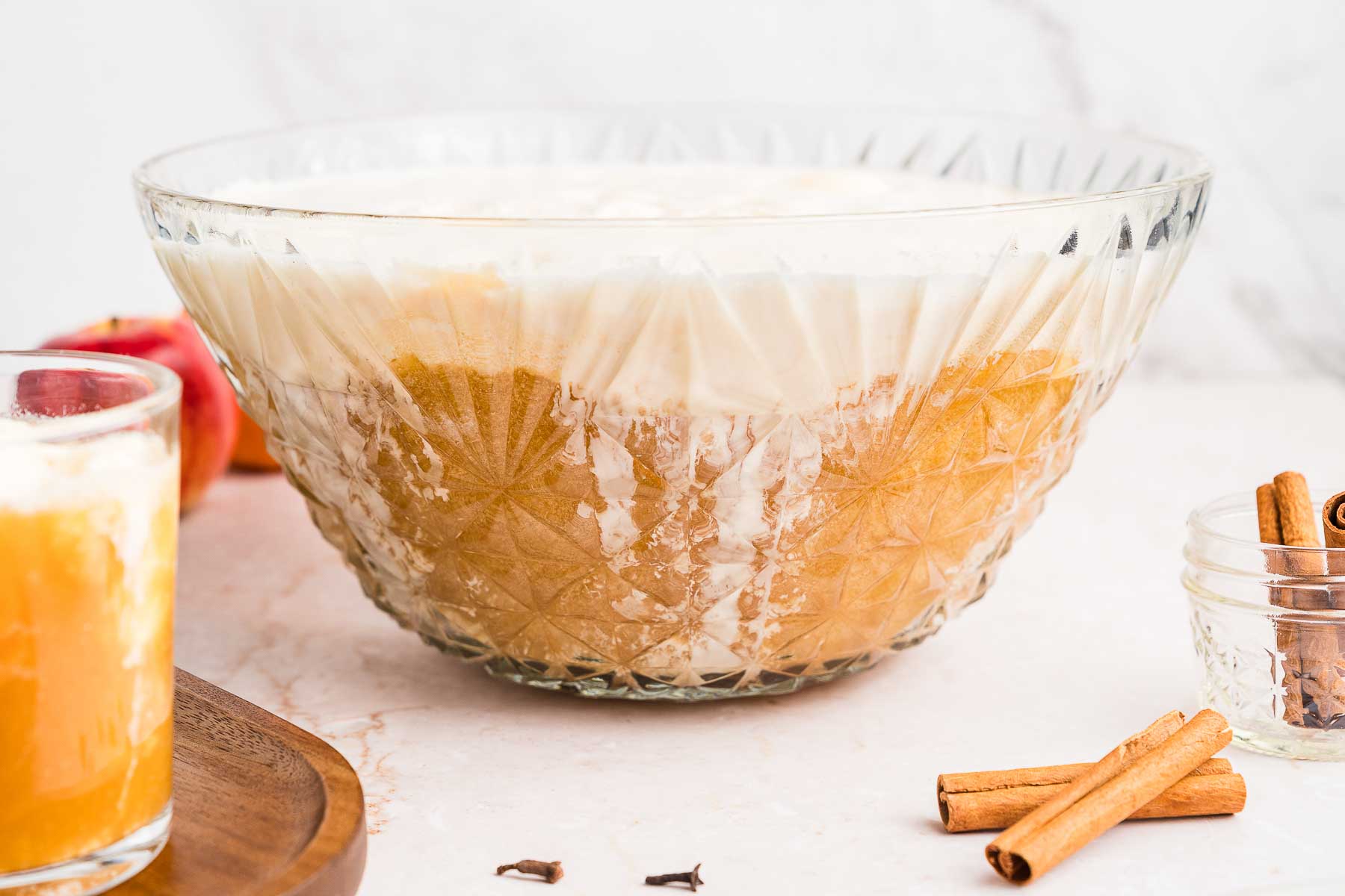 a vintage punch bowl with spiced apple cider punch