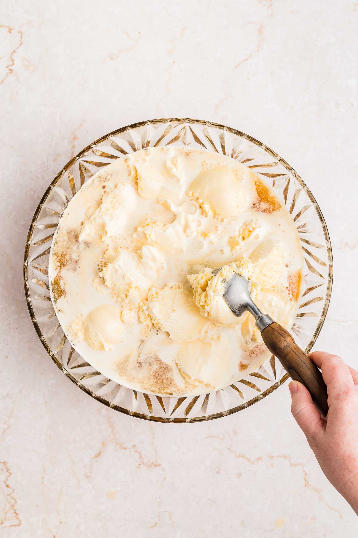 adding ice cream to apple cider punch