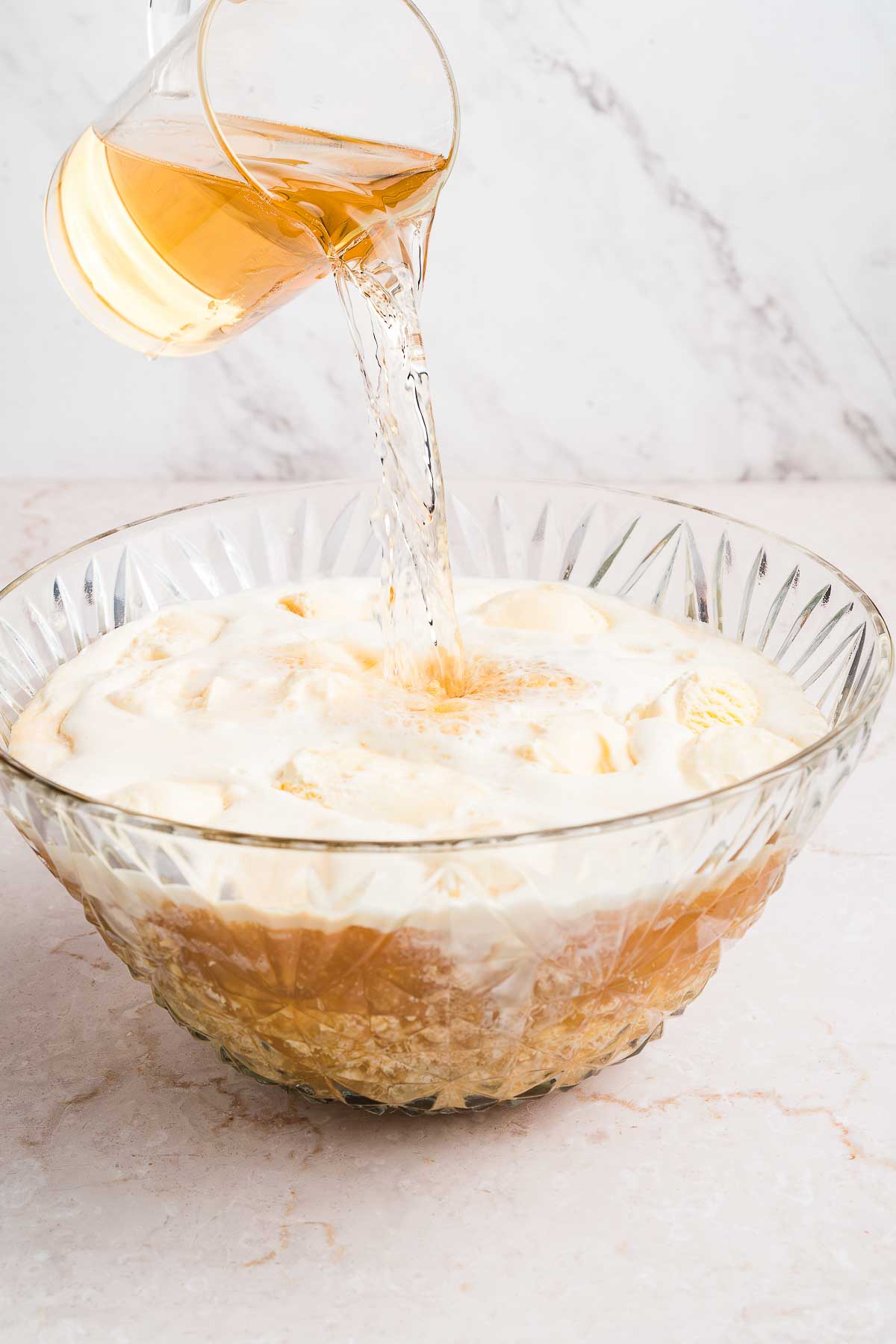 adding ginger ale to punch